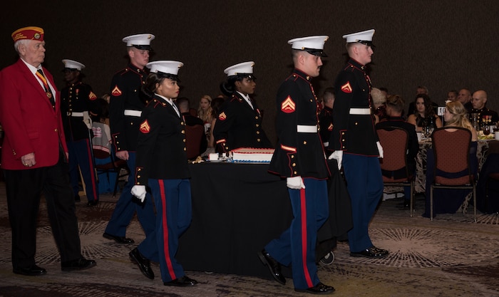 Team Charleston Marines bring in the cake to celebrate the U.S. Marine Corps' 243rd birthday at the annual Marine Corps’ Ball held at the Charleston Area Convention Center Nov. 17, 2018, in Charleston, S.C. Retired Marine Corps Col. Arthur Sass, now a naval science instructor at Eau Claire High School, delivered the keynote address during the ceremony. The Marine Corps was established on Nov. 10, 1775 and its birthday is celebrated with a traditional ball and cake-cutting ceremony.