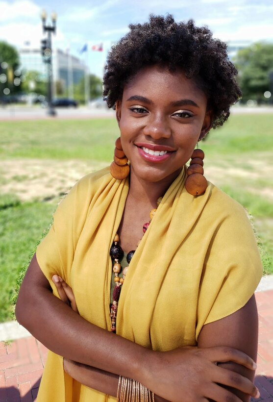 Young woman poses for photo.