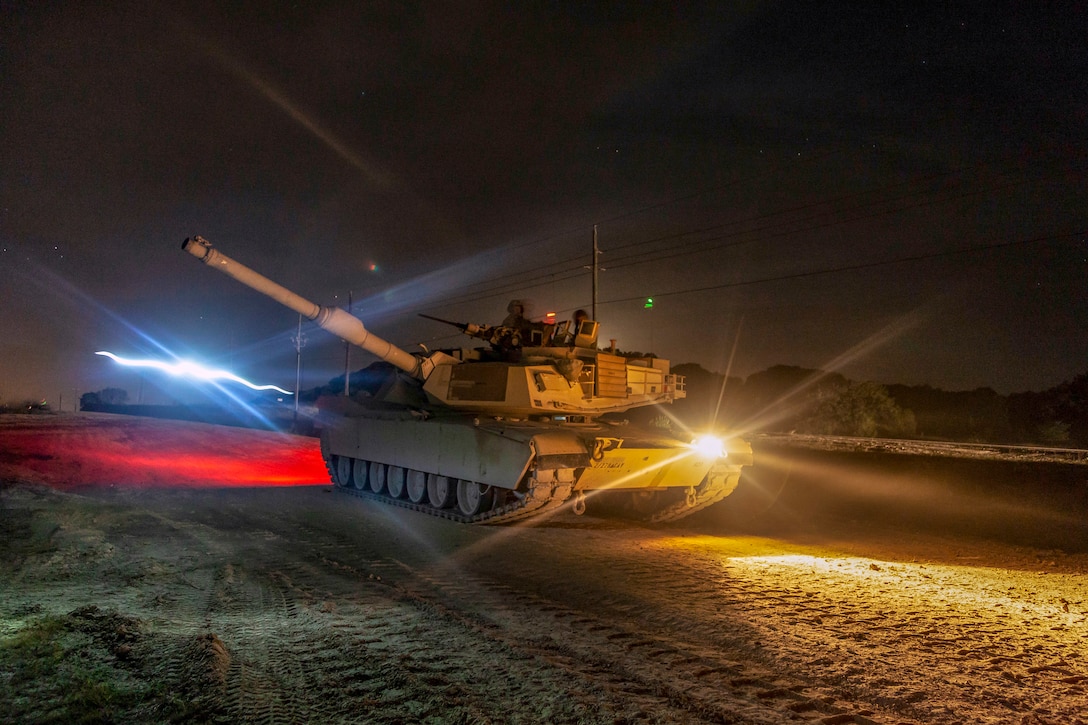 A tank participates in night time training  in Poland.