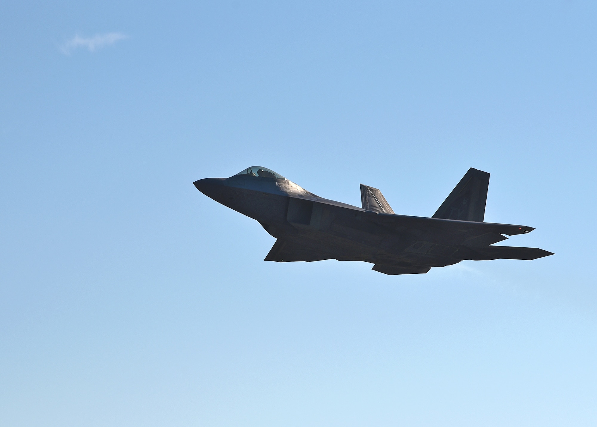 A U.S. Air Force F-22 Raptor from the 325th Fighter Wing flies over the flightline at Tyndall Air Force Base, Fla., Nov. 16, 2018. The F-22 Raptors previously assigned to Tyndall have been diverted to various Air Force installations across the country. (U.S. Air Force photo by Senior Airman Isaiah J. Soliz)