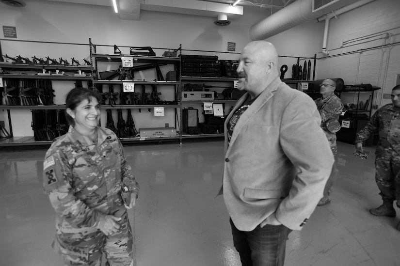 Brig. Gen. Kris A. Belanger, commanding general of the 85th United States Army Reserve Support Command, meets with Scott Mitten, who oversees the TADS (training aids, devices and simulators) warehouse at Parks Reserve Forces Training Area, Nov. 16, 2018.