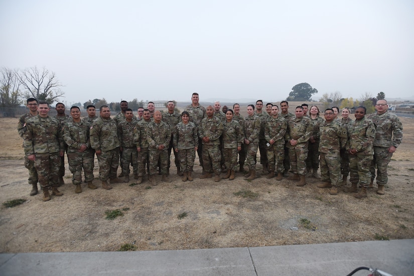 Brig. Gen. Kris A. Belanger, center, commanding general of the 85th United States Army Reserve Support Command, pauses for a photo with Army Reserve Soldiers assigned to the 2-360th Training Support Battalion, 85th Support Command, at Parks Reserve Forces Training Area, Nov. 17, 2018.