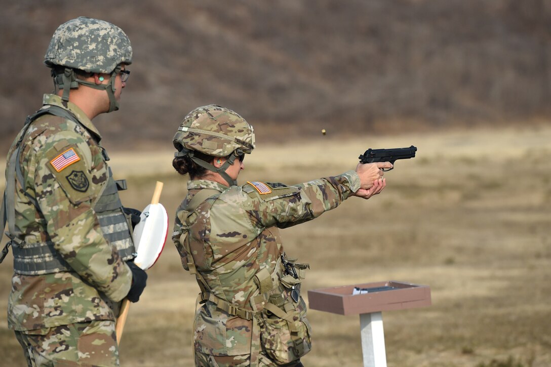 Brig. Gen. Kris A. Belanger, commanding general of the 85th United States Army Reserve Support Command, fires an M9 pistol during a range qualification at Camp Parks, California, Nov. 17, 2018.