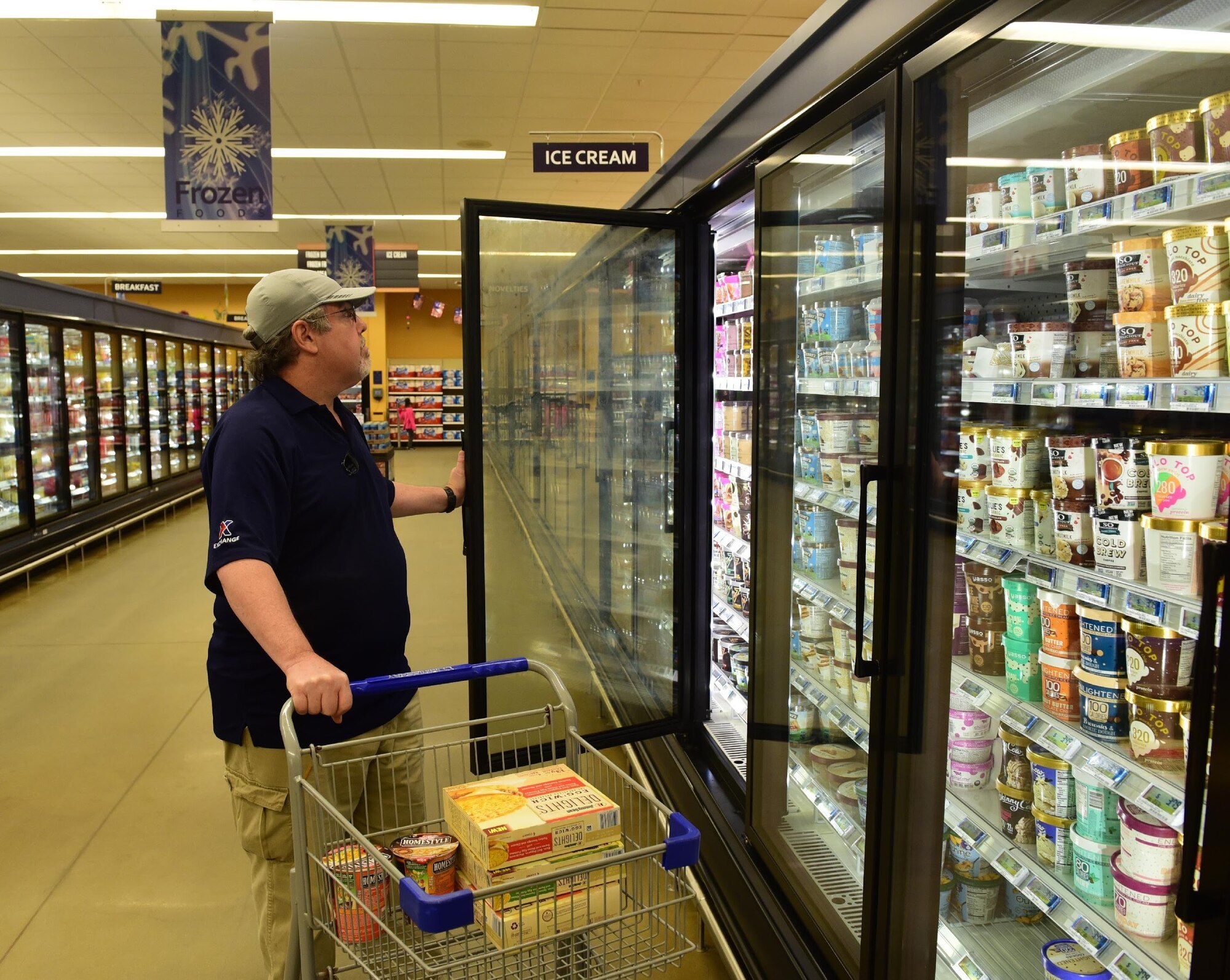 A customer checks out the newly stocked chilled items Nov. 19, 2018, at the Tyndall Air Force Base Commissary. Several customer-service organizations reopened Nov. 17 for DOD ID cardholders to utilize. Many services on Tyndall were temporarily shut down due to the damage from Hurricane Michael. (U.S. Air Force photo by Senior Airman Cody R. Miller)