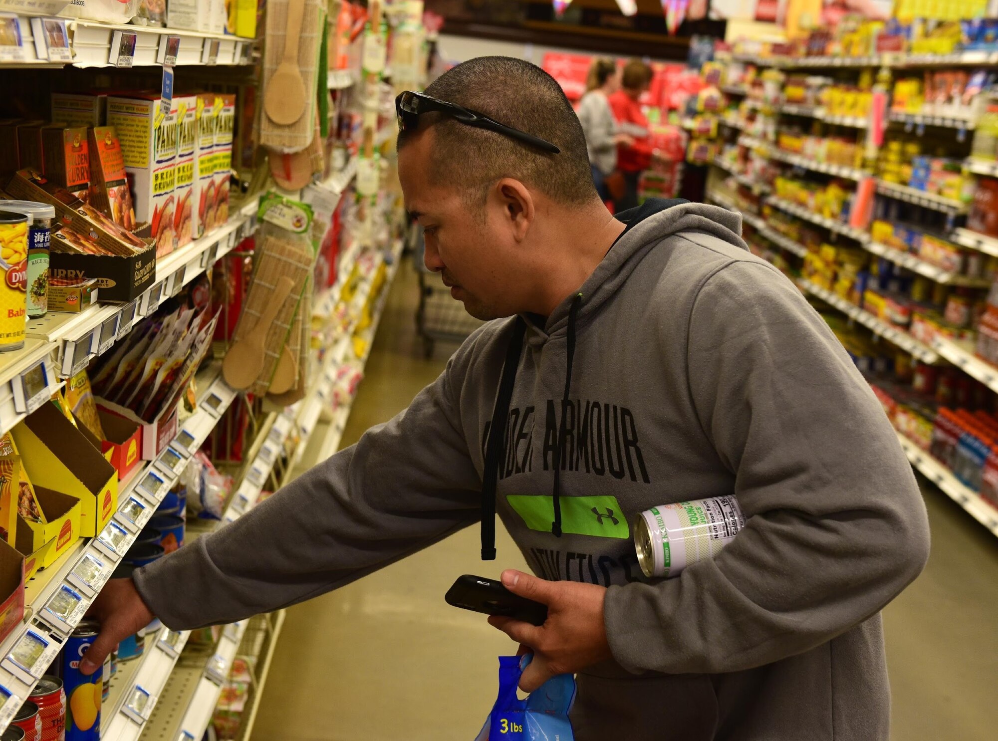 U.S. Air Force Master Sgt. Burt Divinagracia, 20th Logistics Readiness Squadron vehicle maintenance technician out of Shaw Air Force Base, S.C., shops Nov. 19, 2018, at the Tyndall Air Force Base Commissary. Though still under minor repair work, the commissary is open and selling goods to those able to get on base. Several customer-service organizations reopened Nov. 17 for DOD ID cardholders to utilize. Many services on Tyndall were temporarily shut down due to the damage from Hurricane Michael. (U.S. Air Force photo by Senior Airman Cody R. Miller)