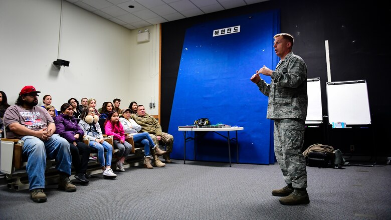U.S. Air Force Col. Les Olberg, commander of the 694th Intelligence, Surveillance and Reconnaissance Group, welcomes spouses and families of Air and Space Operations Center Airmen to a tour of their facility on Osan Air Base, Nov. 16, 2018.