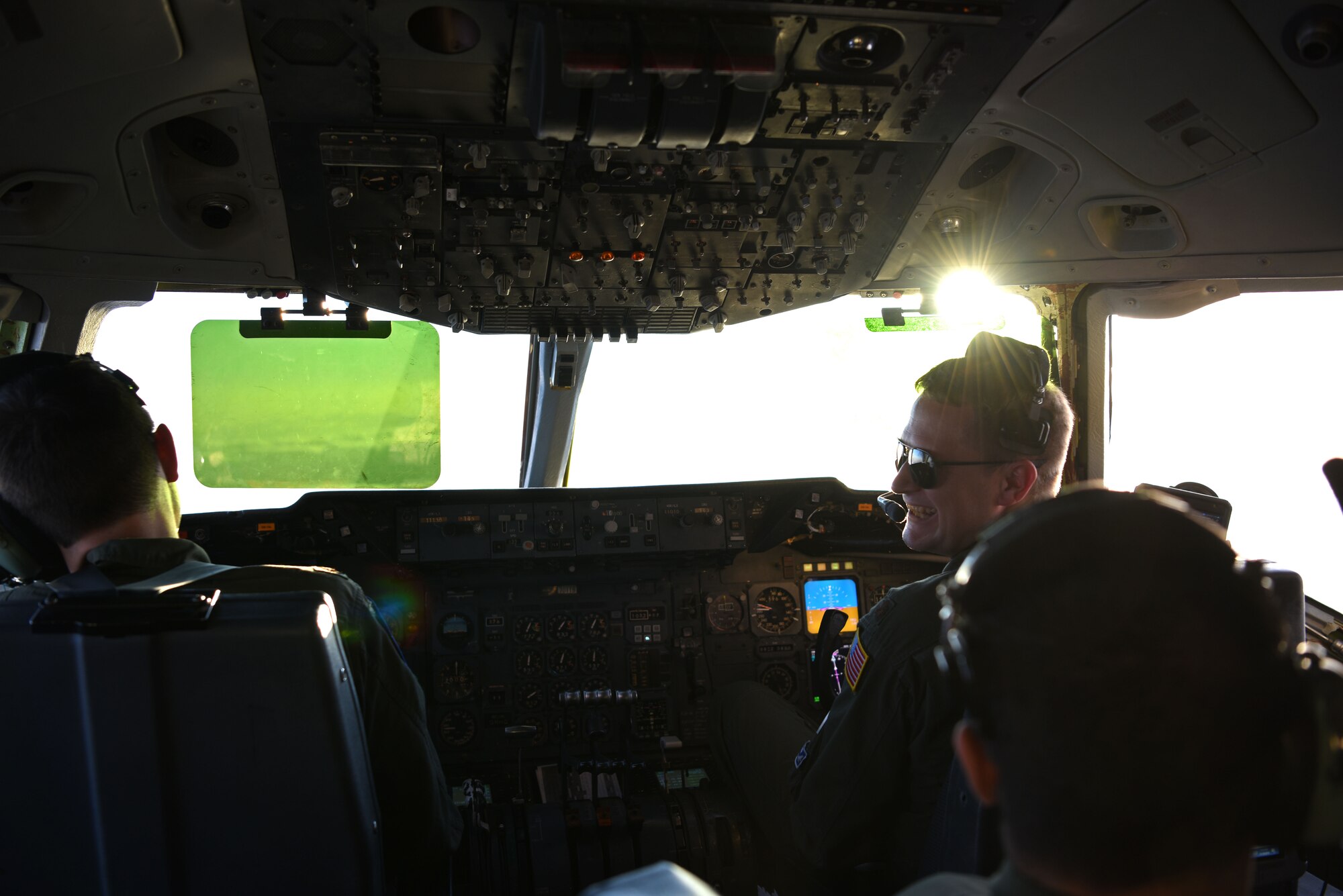 U.S. Air Force KC-10 Extender pilots with the 6th Air Refueling Squadron assigned to Travis Air Force Base, California, converse during a training sortie over the Republic of Korea, Nov. 19, 2018. During the flight, members of the 6th ARS provided mentorship and training to members of the ROK Air Force in order to strengthen and develop their air refueling capabilities. (U.S. Air Force photo by Senior Airman Kelsey Tucker)