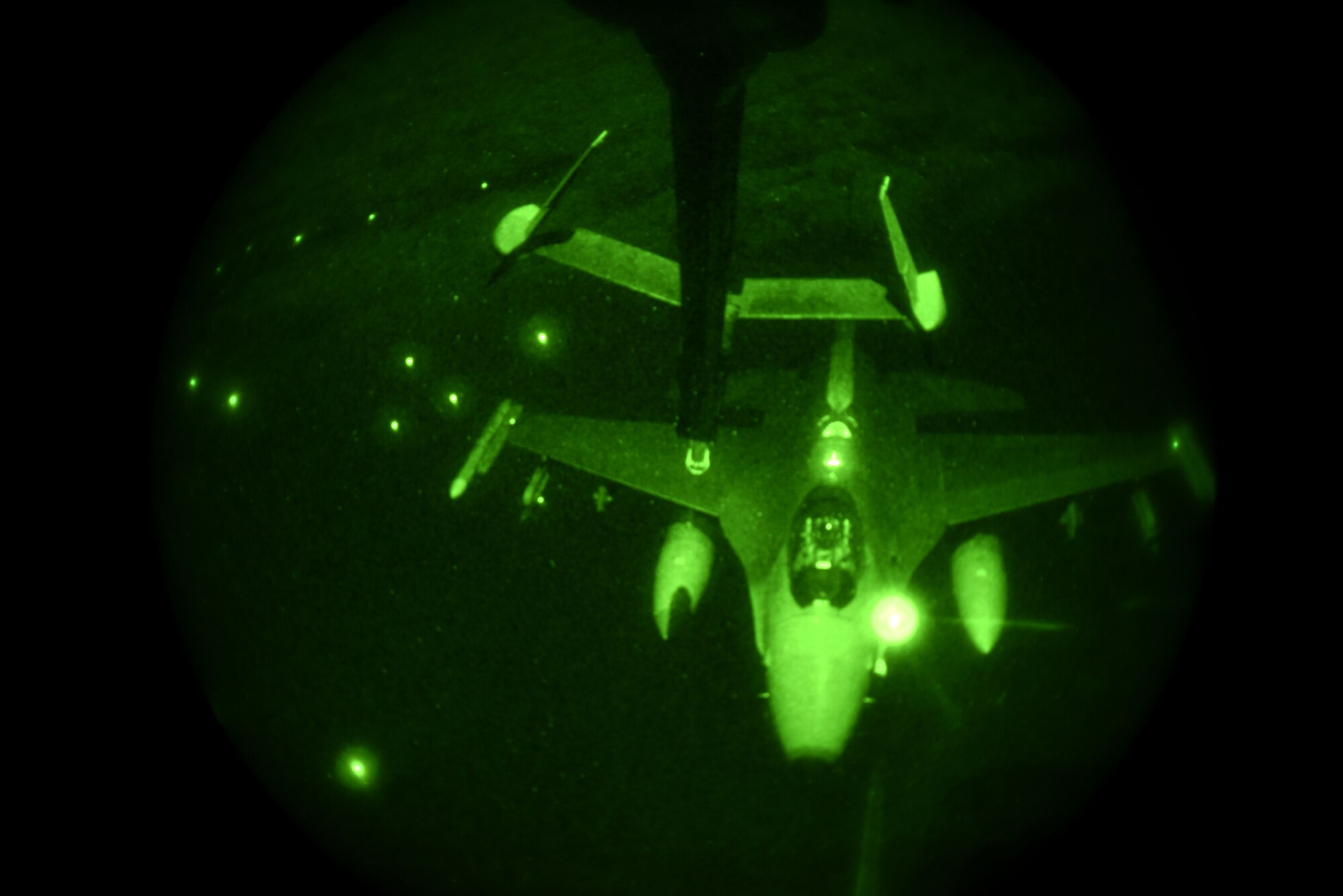 A U.S. Air Force F-16 Fighting Falcon assigned to the 36th Fighter Squadron at Osan Air Base, Republic of Korea, positions to receive fuel midair during a training flight over the ROK, Nov. 19, 2018. A KC-10 Extender with the 6th Air Refueling Squadron assigned to Travis Air Force Base, California, traveled to the ROK in support of nighttime air refueling training for F-16 Fighting Falcons and A-10 Thunderbolt IIs. Simultaneously, members of the ROK Air Force Air Mobility Reconnaissance Command exercised air refueling operations with their U.S. counterparts. (U.S. Air Force photo by Senior Airman Kelsey Tucker)