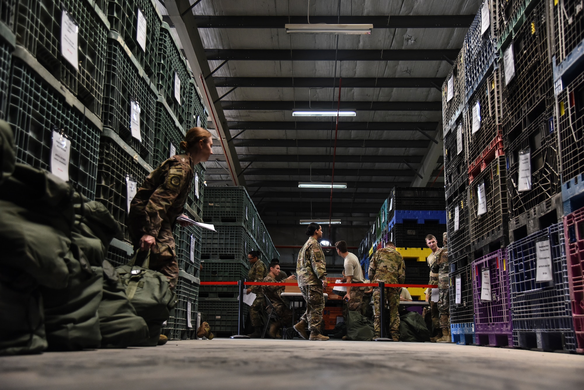 A U.S. Airman assigned to the 380th Air Expeditionary Wing participates in an Individual Protection Equipment readiness exercise at Al Dhafra Air Base, United Arab Emirates, Nov. 9, 2018. The 380th AEW Inspector General team, 380th Expeditionary Logistics Readiness Squadron, and 380th Expeditionary Medical Group teamed up to put ADAB's readiness to the test by pushing personnel out the door with their gear as quickly as possible. (U.S. Air Force photo by Senior Airman Mya M. Crosby)