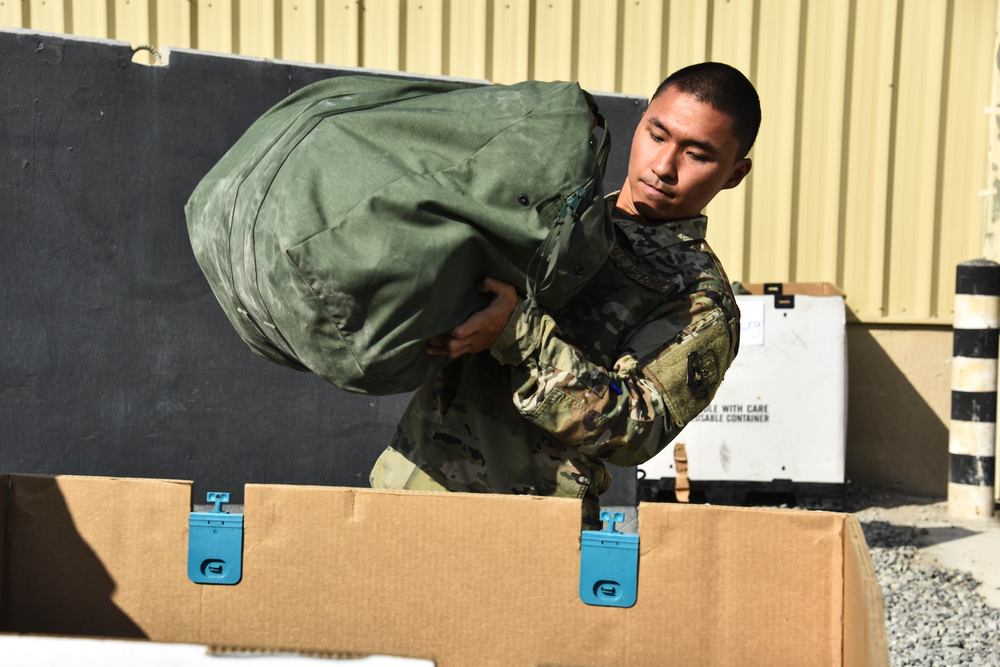 A U.S. Airman assigned to the 380th Air Expeditionary Wing participates in an Individual Protection Equipment readiness exercise at Al Dhafra Air Base, United Arab Emirates, Nov. 9, 2018. The objective of the exercise was to evaluate the 380th AEW's ability to rapidly equip members with Chemical, Biological, Radiological and Nuclear defense equipment, as well as Biological and Chemical Warfare kits. (U.S. Air Force photo by Senior Airman Mya M. Crosby)