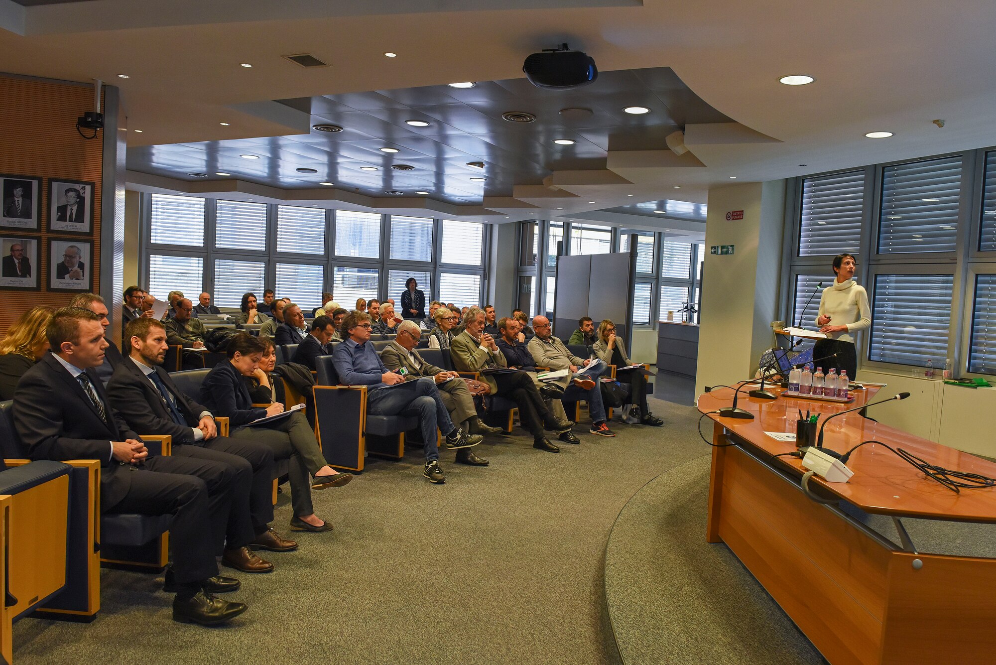 Ivana Barac, 31st Contracting Squadron contract specialist, speaks to contractors during the Industry Day conference in Pordenone, Italy, Nov. 9, 2018. The conference was an opportunity for the 31 CONS to develop a better working relationship with local businesses, as well as offer more information to these businesses about working on the installation. (U.S. Air Force photo by Senior Airman Valerie Halbert)