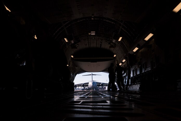 Reserve Citizen Airmen from the 315th Aeromedical Evacuation Squadron load medical equipment onto a C-17 Globemaster III during an operational readiness exercise at Joint Base Charleston, S.C., Nov. 17, 2018. The exercise provided the 315th Operations Group with hands-on training in a variety of airlift and aeromedical evacuation tactics during simulated combat events. (U.S. Air Force photo by Staff Sgt. Nicholas A. Priest)