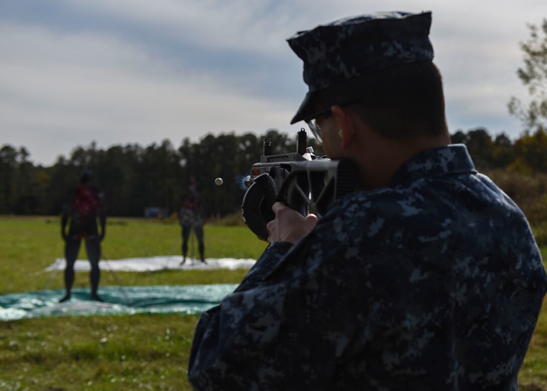 A student in the Joint Non-Lethal Weapons Program class fires at a target during a demonstration at Joint Base Langley-Eustis, Virginia, Nov. 8, 2018.