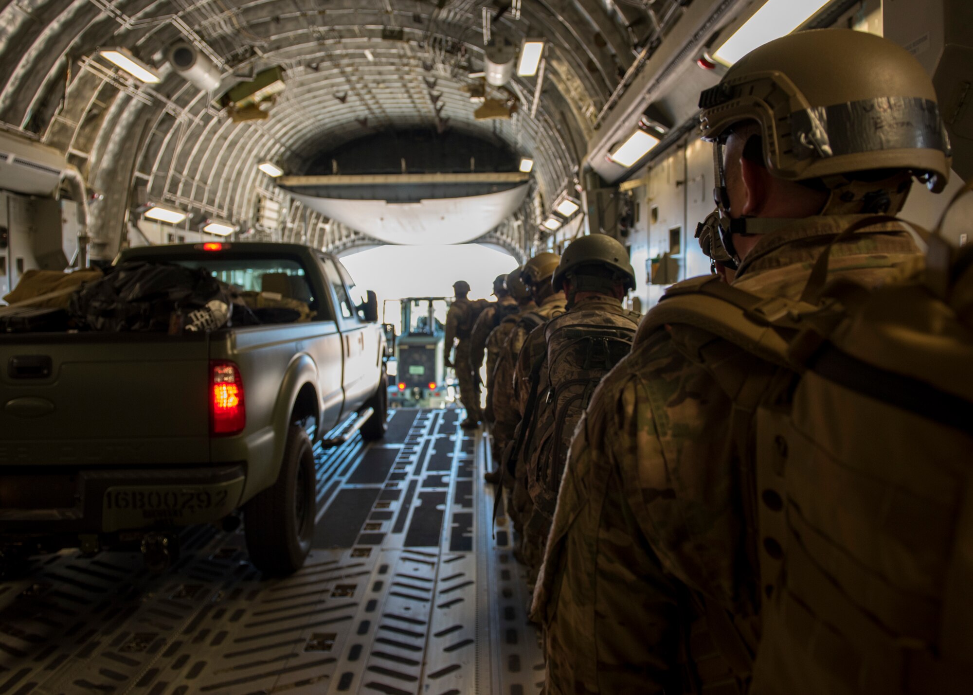 Airmen assigned to the 621st Contingency Response Support Squadron, Joint Base McGuire-Dix-Lakehurst, N.J., exit a C-17 Globemaster III cargo aircraft during Exercise JERSEY WRATH 19-1 in Mesa, Ariz., Nov. 13, 2018. The 621st CRSS participated in the mobility-centric training exercise which integrated both mobility and combat assets in a realistic training scenario. (U.S. Air Force photo by Airman 1st Class Jacob Wongwai)