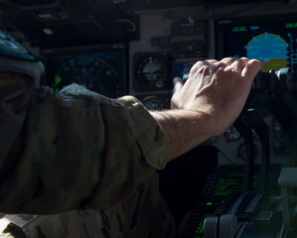 A pilot assigned to the 6th Airlift Squadron, Joint Base McGuire-Dix-Lakehurst, N.J., flies a C-17 Globemaster III cargo aircraft during Exercise JERSEY WRATH 19-1 over Arizona, Nov. 13, 2018. The exercise consisted of a realistic training scenario where C-17s executed mock deployment maneuvers. (U.S. Air Force photo by Airman 1st Class Jacob Wongwai)