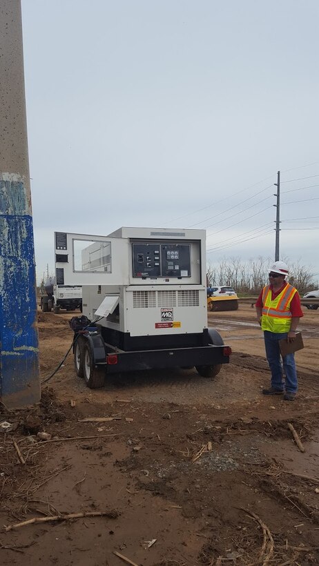 MANATI, Puerto Rico -- A District power team member inspects a generator at a water pump station in one of the hardest hit places by Hurricane Maria, Sept. 30, 2017. Photo by Shannon Silva. This was a 2018 photo drive entry.