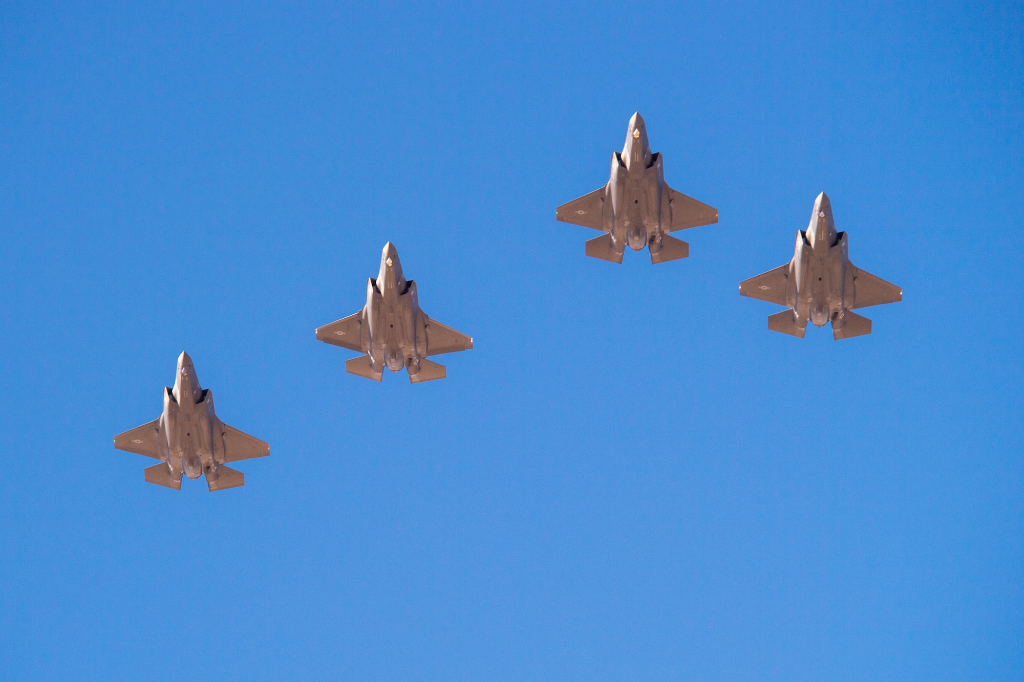 F-35A Lightning IIs from the 388th and 419th Fighter Wing fly by in formation as part of a combat power exercise at Hill Air Force Base, Utah. The exercise aims to confirm their ability to quickly employ a large force of jets against air and ground targets, and demonstrate the readiness and lethality of the F-35 Lightning II. As the first combat-ready F-35 units in the Air Force, the 388th and 419th FWs are ready to deploy anywhere in the world at a moment’s notice. (United States Air Force photo/Cynthia Griggs)