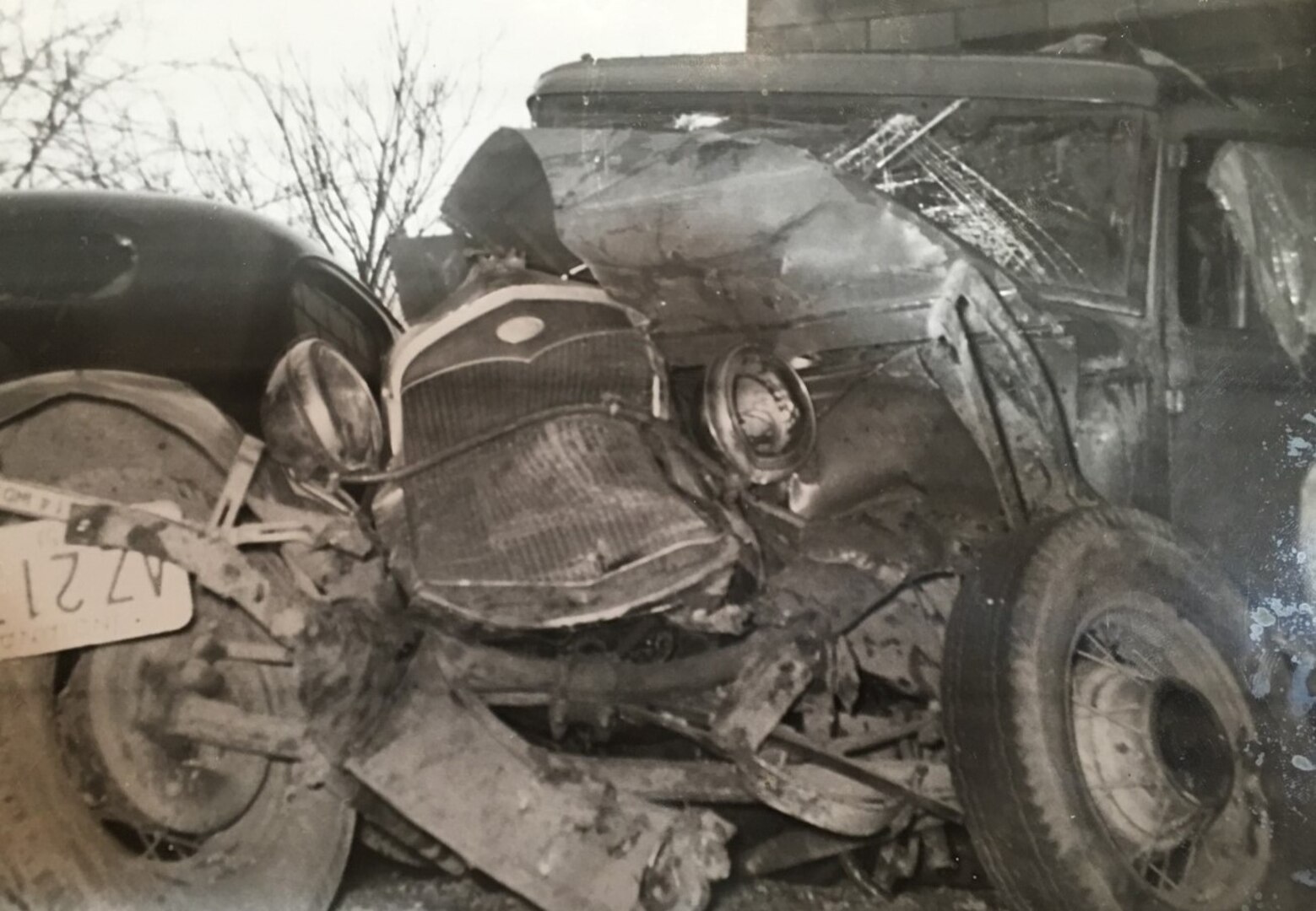 B&W phot, wrecked 1930s car