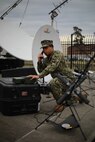Navy Petty Officer 1st Class Albert A. Givens demonstrates how to set up a Mobile User Objective Service (MUOS), SATCOM system at Joint Task Force Civil Support (JTF-CS) on Nov. 19, 2018. The MUOS is the next generation of tactical satellite service designed to provide commanders an immediate means to communicate at any location or infrastructure. When directed, JTF-CS is ready to respond in 24 hours to provide command and control of 5,200 federal military forces located at more than 36 locations throughout the nation in support of civil authority response operations to save lives, prevent further injury and provide critical support to enable community recovery. (Official DoD photo by U.S. Air Force Tech. Sgt. Michael Campbell/ Released)