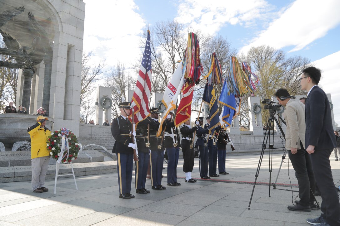 On Nov. 20, 2018 a trumpet player from "The President's Own" U.S. Marine Band performed for the ceremony and wreath presentation at the World War II Memorial’s Pacific Arch to mark the 75th anniversary of the Battle of Tarawa. The 1943 U.S. amphibious landing at the heavily fortified, Japanese-held island of Betio in the Tarawa Atoll in the Gilbert Islands was “the toughest battle in Marine Corps history” according to onecombat correspondent. (U.S. Marine Corps photo by Master Sgt. Kristin duBois/released)