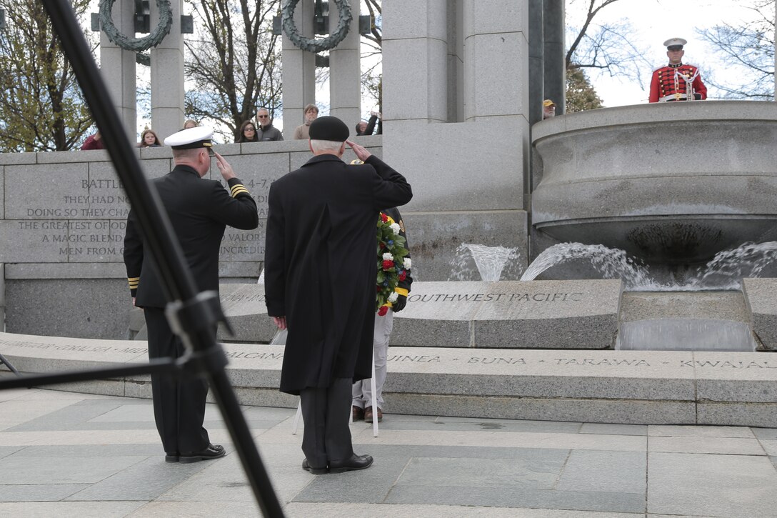 On Nov. 20, 2018 a trumpet player from "The President's Own" U.S. Marine Band performed for the ceremony and wreath presentation at the World War II Memorial’s Pacific Arch to mark the 75th anniversary of the Battle of Tarawa. The 1943 U.S. amphibious landing at the heavily fortified, Japanese-held island of Betio in the Tarawa Atoll in the Gilbert Islands was “the toughest battle in Marine Corps history” according to onecombat correspondent. (U.S. Marine Corps photo by Master Sgt. Kristin duBois/released)