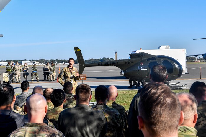 Lt. Col. Tim Foster, 437th Operations Group special operations director, gives a speech during the dedication of an OH-6 Cayuse, Nov. 16, 2018, at Joint Base Charleston, S.C. The helicopter, donated by the Defense Logistics Agency, was refurbished by the 437th Maintenance Group for the special operations unit to use for training. It will be used by their loadmasters to train winching and helicopter loading procedures, as well as rapid loading and offloading procedures in blacked out conditions.
