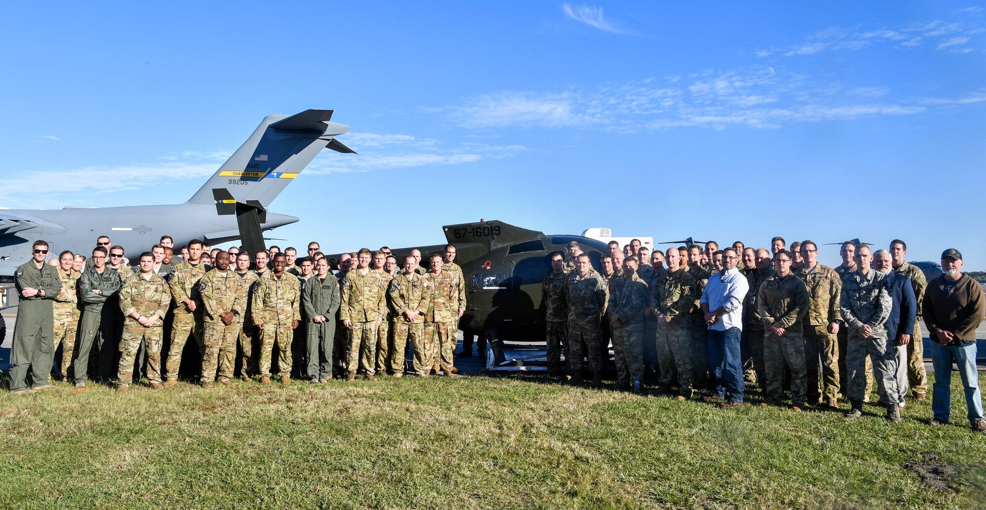 Airmen from the 437th Operations Group special operations unit pose in front of their new training helicopter Nov. 16, 2018, at Joint Base Charleston, S.C.