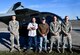437th Aircraft Maintenance Squadron Airmen pose in front of a training helicopter they repaired for the 437th Operations Group special operations unit Nov. 16, 2018, at Joint Base Charleston, S.C. The helicopter, donated by the Defense Logistics Agency, was refurbished by the 437th MXS for the special operations unit to use for training. It will be used by their loadmasters to train winching and helicopter loading procedures, as well as rapid loading and offloading procedures in blacked out conditions.