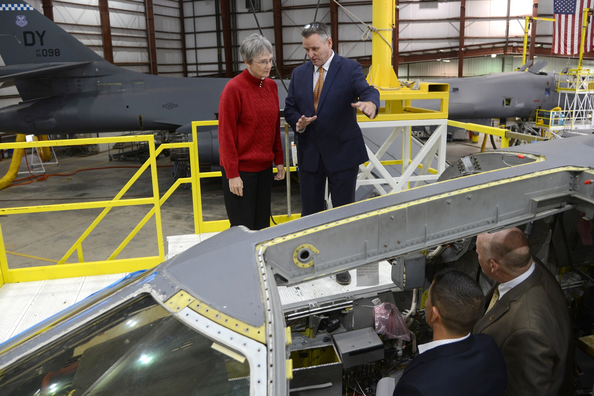 Rodney Shepard, 567th Aircraft Maintenance Squadron deputy director, provides an overview on the B-1 Integrated Battle Station modification operations to Secretary of the Air Force Heather Wilson during her tour of Tinker Air Force Base Nov. 16. Jason Mann, an engineer with the Reverse Engineering and Critical Tooling Lab, bottom left, and Jerry Osborne, 567th AMXS, also provided information on the modifications during her time at the Maintenance Repair and Overhaul Technical Center.