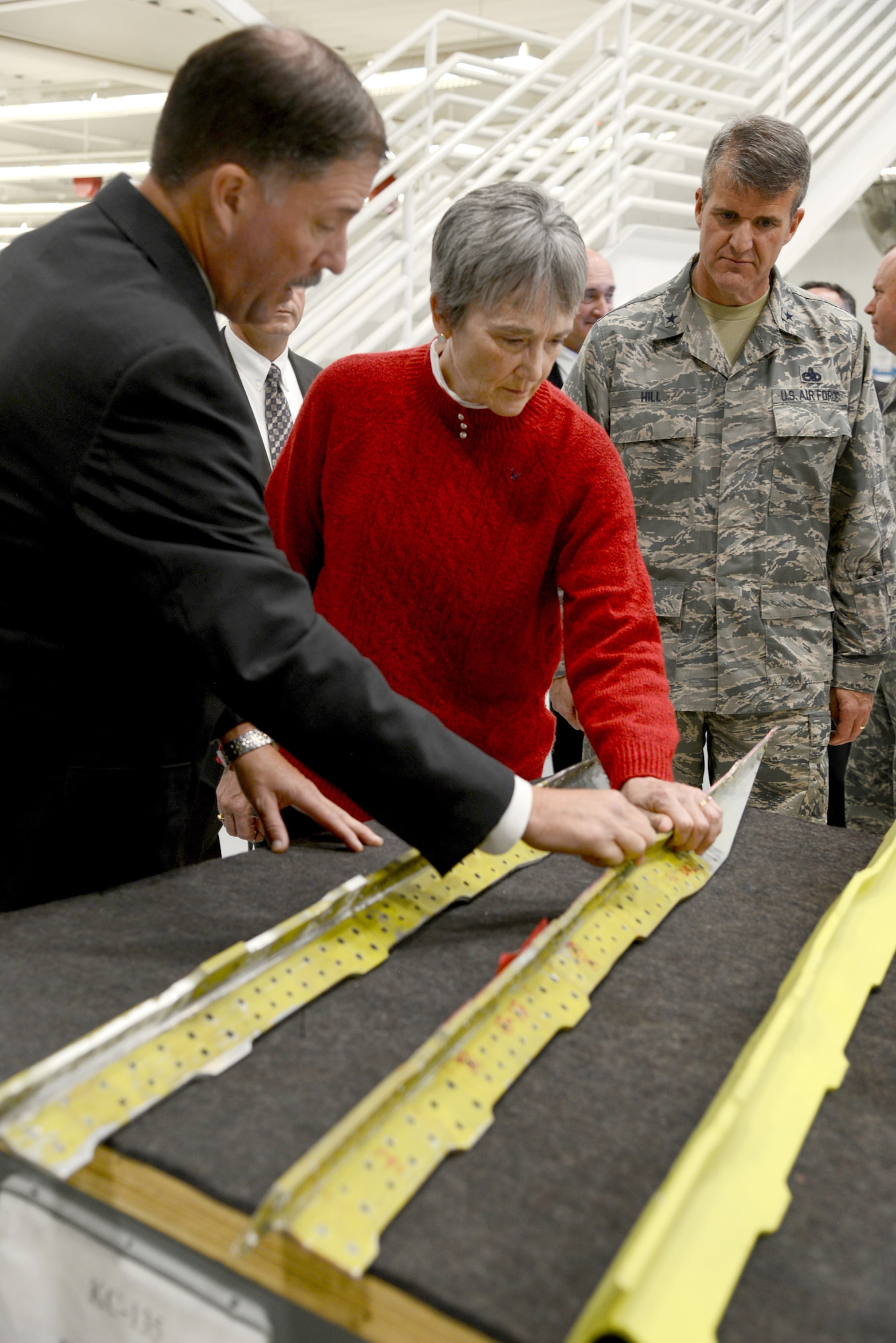 Craig Rayner, 564th Aircraft Maintenance Squadron deputy director, shows Secretary of the Air Force Heather Wilson, a structural part of the KC-135 Stratotanker during the secretary’s visit here Nov. 16th. Wilson was shown how the KC-135 programmed depot maintenance line's sustainment operations are extending the aircrafts’ service life and capability enhancement using Art of the Possible ideals.