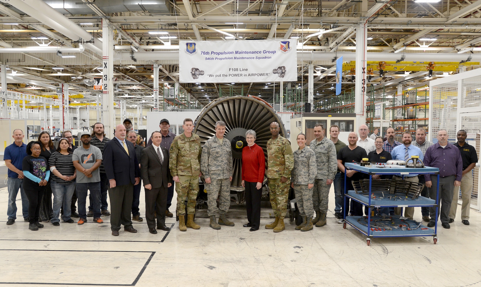 Secretary of the Air Force Heather Wilson, center, was able to thank members of the 76th Propulsion Maintenance Group F108 engine line after learning about their Art of the Possible production success. Wilson is surrounded by senior leadership here as well as workers critical to meeting on-time delivery goals to the customer.