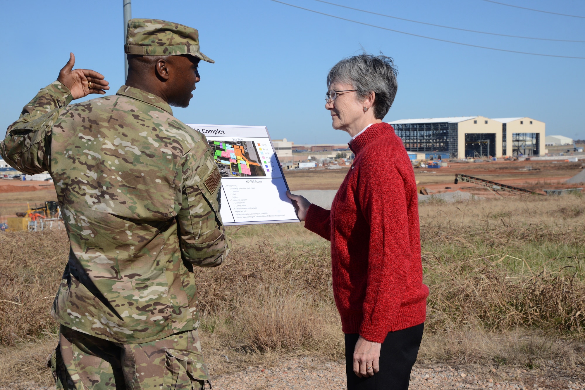 Col. Kenyon Bell, 72nd Air Base Wing commander, gives Secretary of the Air Force Heather Wilson, an overview of the KC-46A program and its maintenance campus under construction in the background during her visit to Tinker Air Force Base Nov. 16. This is Wilson’s first visit to Tinker since becoming secretary.