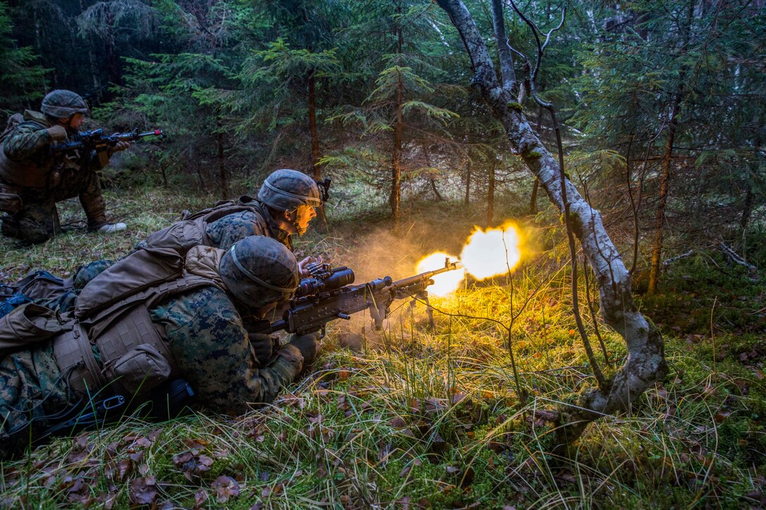 Two marines fire on a position.
