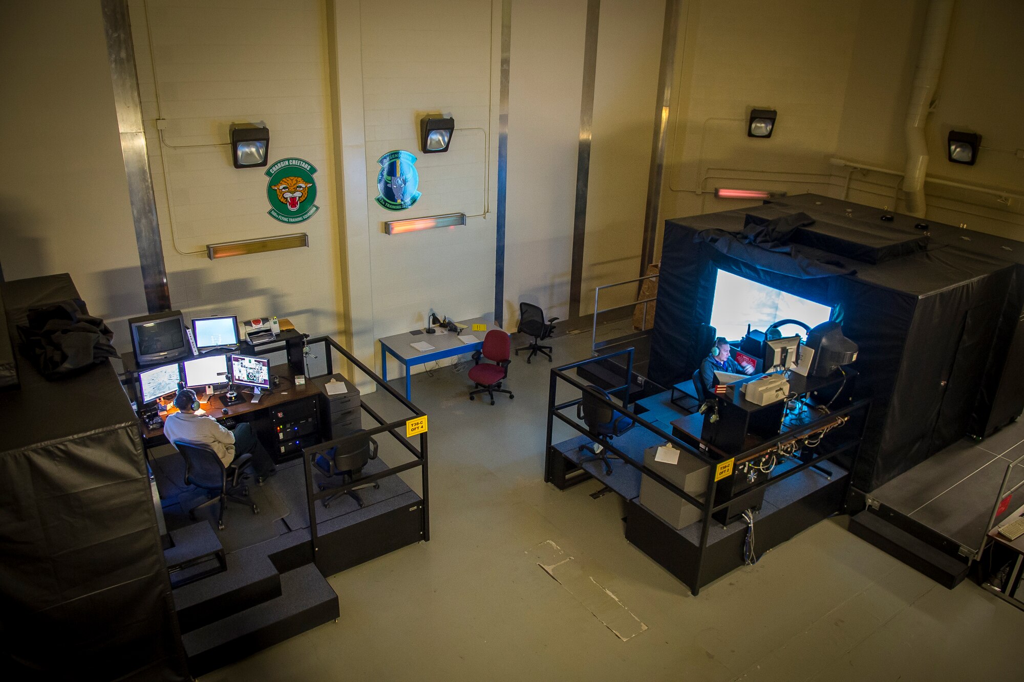 Two 12th Training Squadron instructor pilots teach student pilots in T-38C Talon simulators during Introduction to Fighter Fundamentals on Nov. 8, 2018 at Joint Base San Antonio - Randolph. These simulators allow students to fly in a wide range of conditions and create a variety of challenges for the students to overcome.