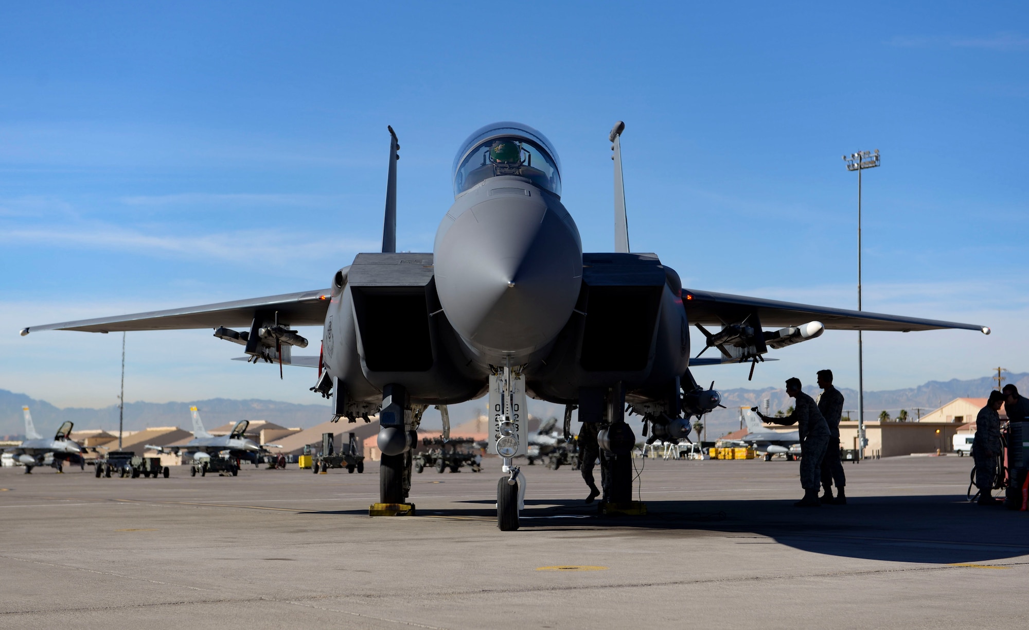 An F-15E Strike Eagle fighter jet prepares to launch during a Gunsmoke Competition Nov. 15, 2018 at Nellis Air Force Base, Nevada. From weapons personnel loading the live weapons and crew chiefs perfectly launching the aircraft, to pilots using those weapons to hit their targets, each team was judged on their safety and execution. (U.S. Air Force photo by Airman Bailee A. Darbasie)
