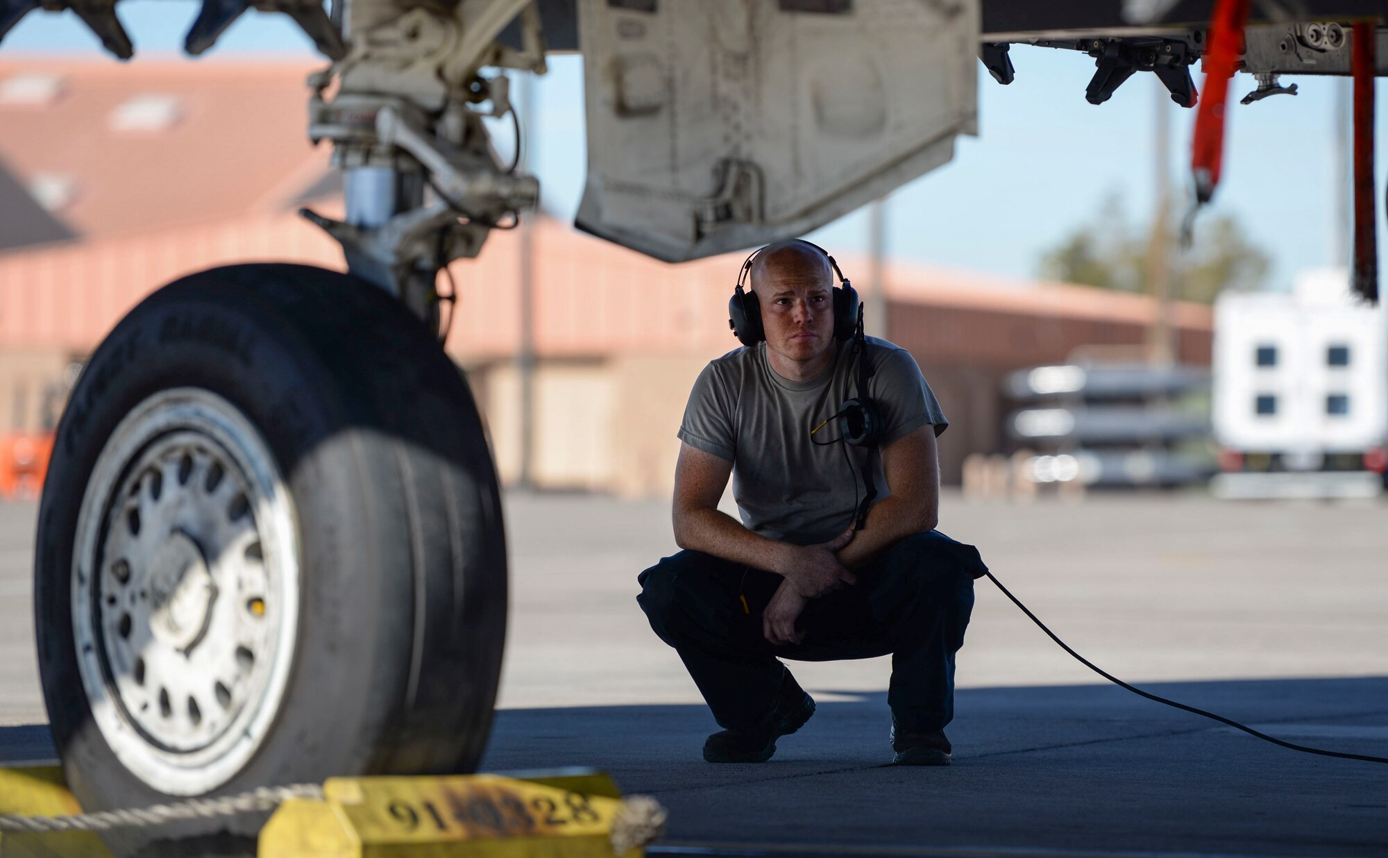 Senior Airman Joshua Cowart, 757th Aircraft Maintenance Squadron Strike Aircraft Maintenance Unit F-15E Strike Eagle fighter jet maintainer, prepares an F-15E for launch Nov. 15, 2018 at Nellis Air Force Base, Nevada. Cowart was one of many participants representing Strike AMU during a Gunsmoke Competition at Nellis. (U.S. Air Force photo by Airman Bailee A. Darbasie)