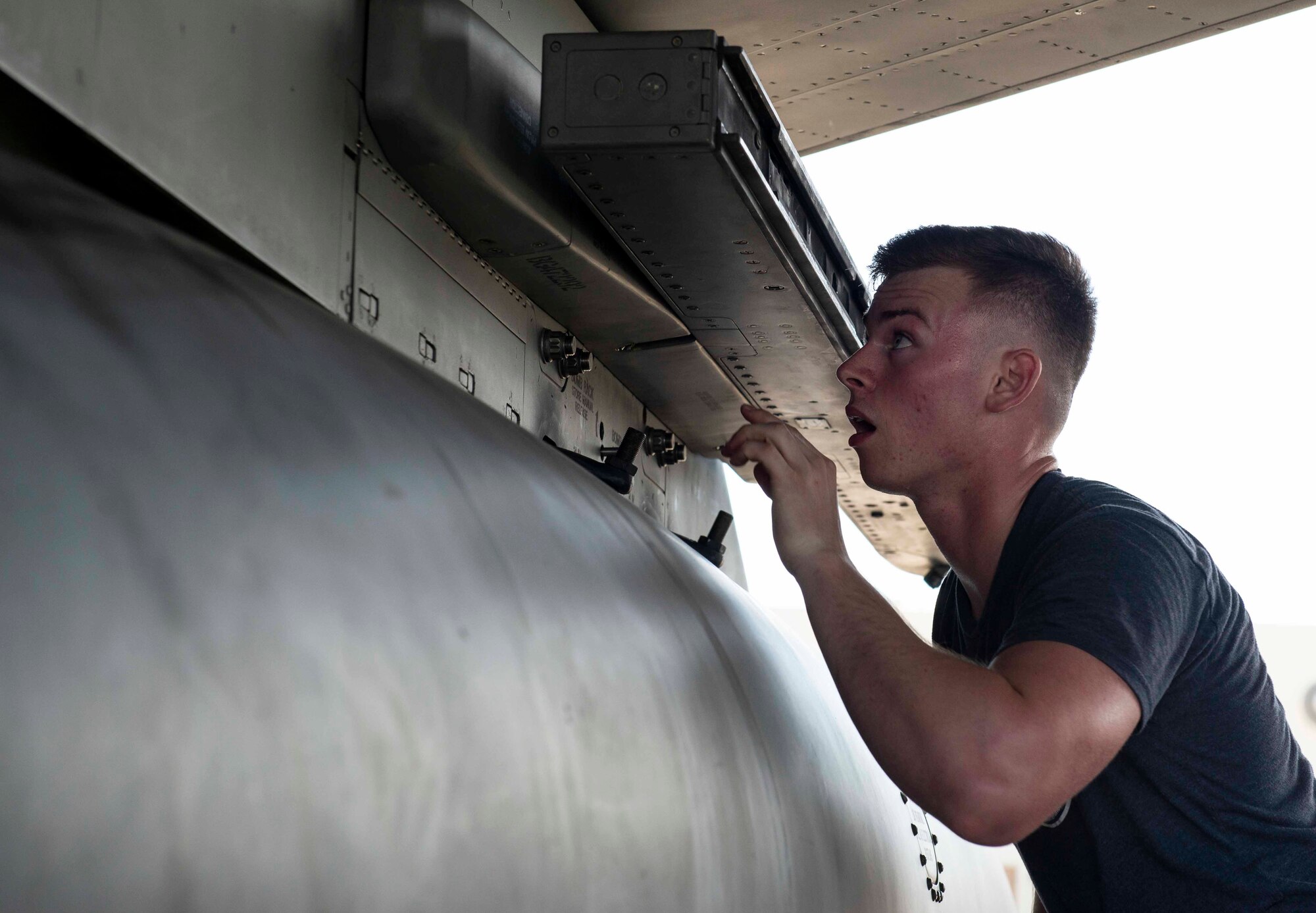 U.S. Air Force Airman 1st Class Brandon Carson, 44th Aircraft Maintenance Unit weapons load crew member, works quickly to load munitions onto an F-15 Eagle during a load competition Oct. 26, 2018, at Kadena Air Base, Japan. Load competitions give Airmen an opportunity to test their skills and efficiency in a light-hearted competition.