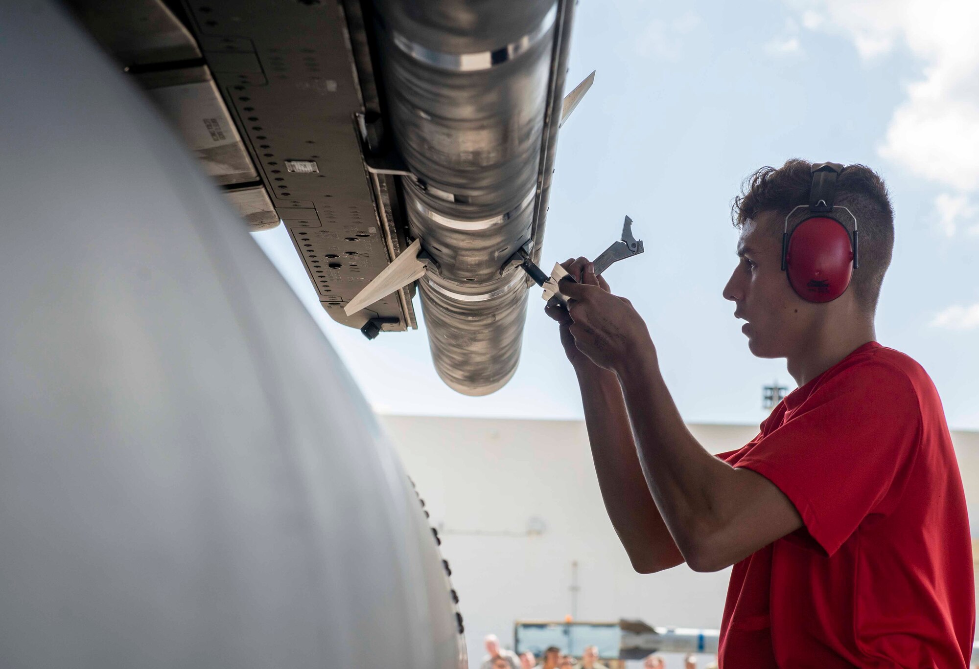 U.S. Air Force Airman 1st Class John Sliwka, 67th Aircraft Maintenance Unit weapons load crew member, loads munitions during a load competition Oct. 26, 2018, at Kadena Air Base, Japan. The AMUs not only competed against one another, but the clock as well.