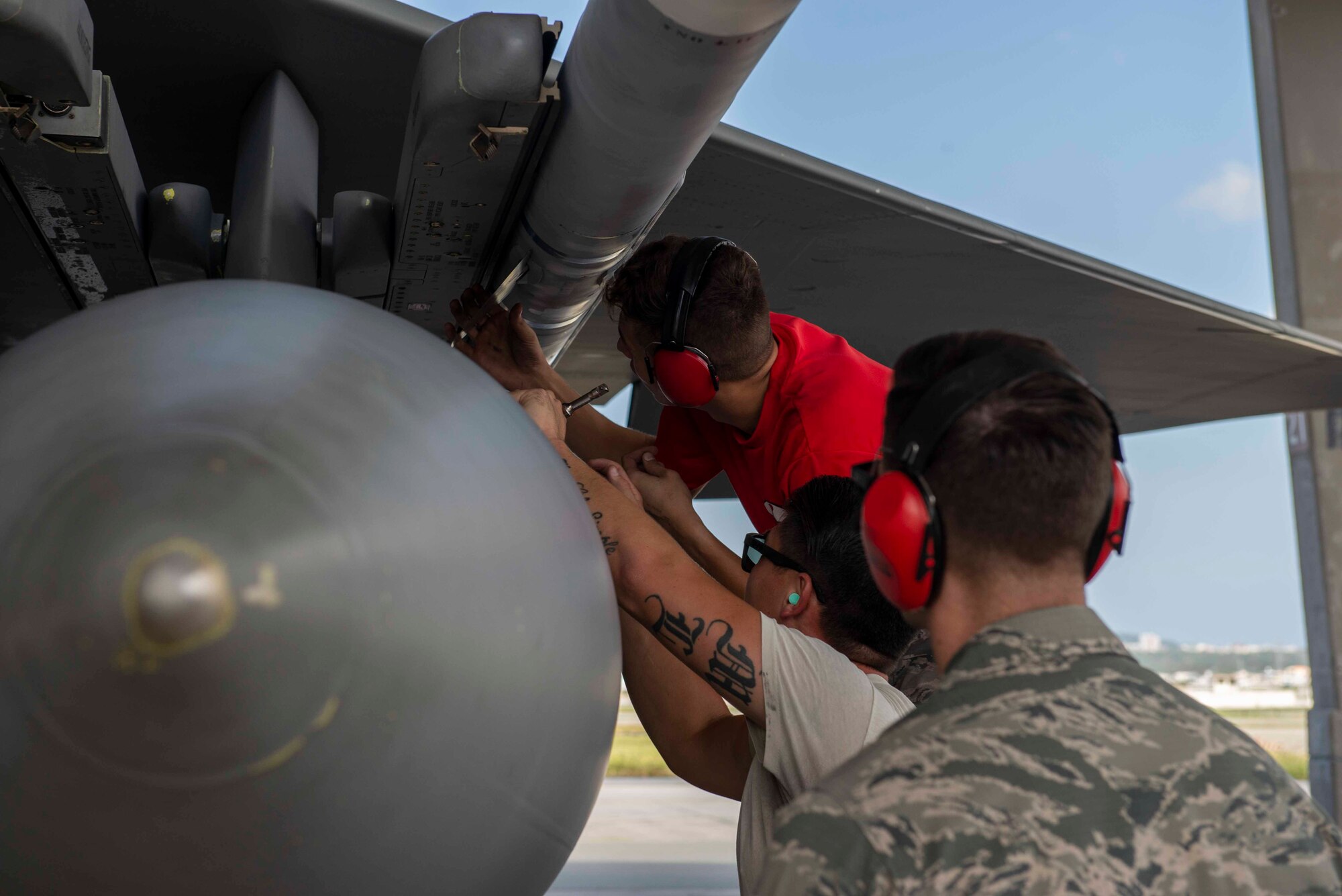 Members of the 67th Aircraft Maintenance Unit are evaluated as they load munitions onto an F-15 Eagle during a load competition Oct. 26, 2018, at Kadena Air Base, Japan. Each unit had members cheering them on as they raced against the clock and opposing team.