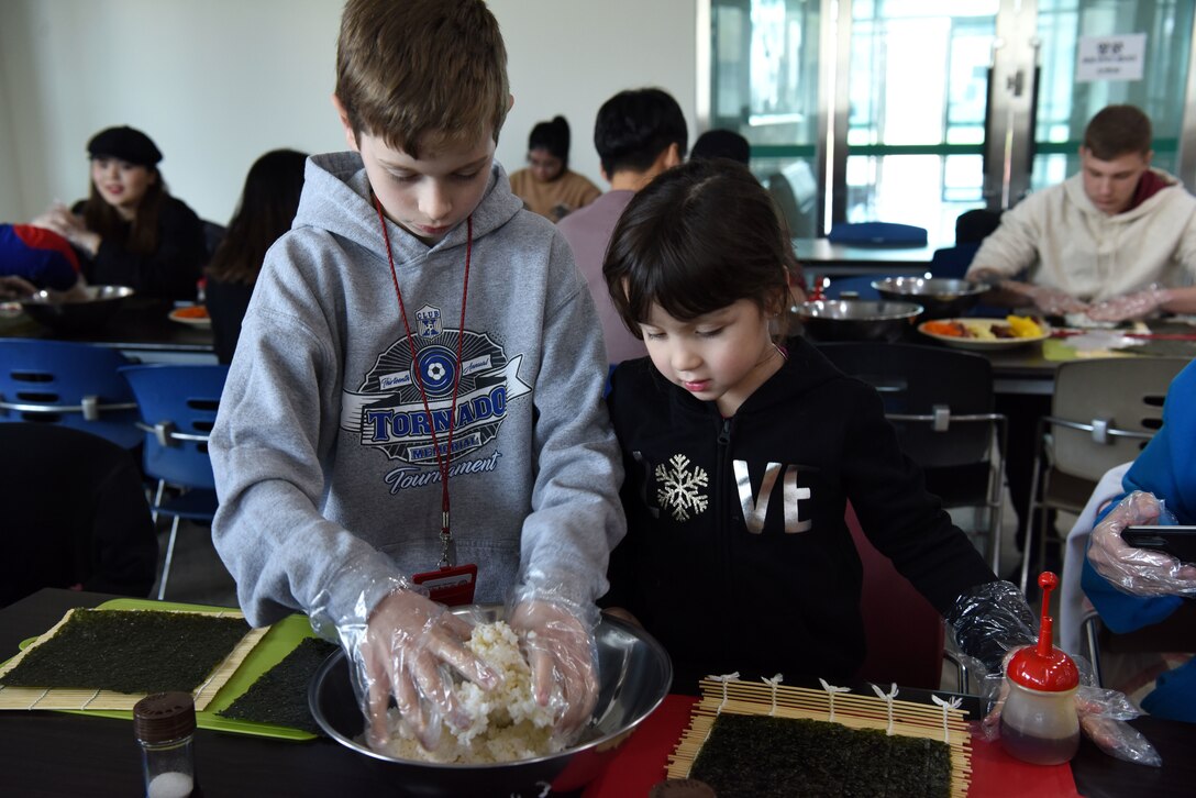 Children from Osan Air Base, Republic of Korea learn how to make kimbap during the Head Start Program at Pyeongtaek University, Pyeongtaek, ROK, Nov. 13, 2018. The program aims to improve the quality of life for service members, their dependents and civilians stationed in the ROK by teaching them about Korean society, culture and the history of the U.S.-ROK alliance. (U.S. Air Force photo by Senior Airman Kelsey Tucker)