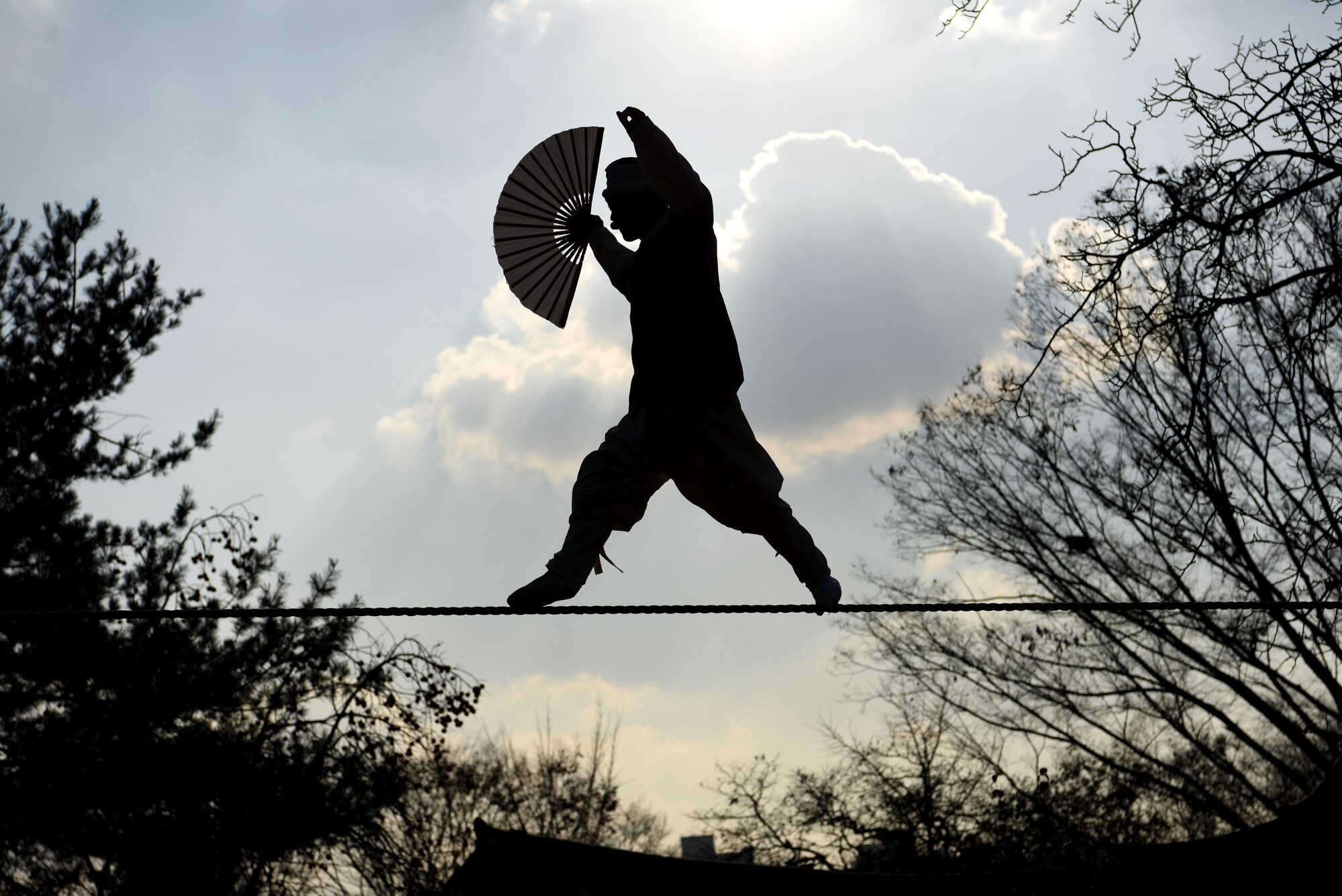 A performer showcases acrobatics on a tightrope at the Korean Folk Village, Yongin, Republic of Korea, Nov. 13, 2018. The Korean Folk Village was the last stop of the Head Start Program, which included two days of informational classes and hands-on experiences around the Gyeonggi Province of South Korea. (U.S. Air Force photo by Senior Airman Kelsey Tucker)