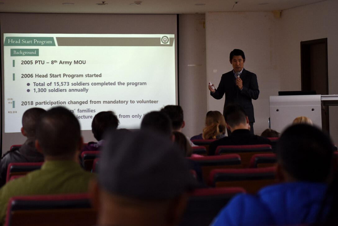 Members of the U.S. armed forces and their dependents listen as a speaker gives the history of the Head Start Program at Pyeongtaek University, Pyeongtaek, Republic of Korea, Nov. 12, 2018. The Head Start Program gives ROK newcomers an introduction to Korean history, culture, customs and language. (U.S. Air Force photo by Senior Airman Kelsey Tucker)