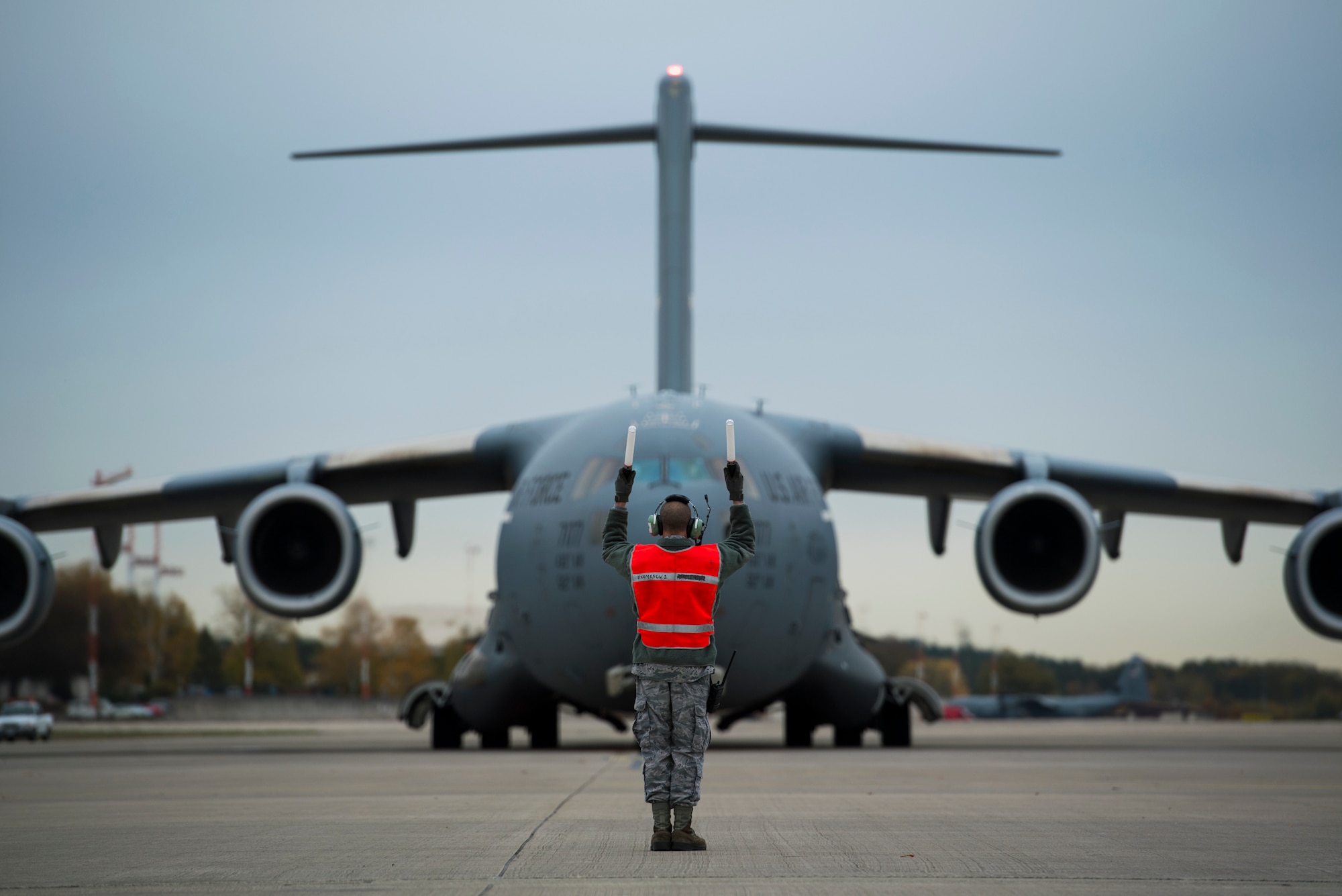 U.S. Air Force Senior Airman Clark Dewhitt, 721st Aircraft Maintenance Squadron propulsions journeyman, takes a photo of damage on a C-17 Globemaster III engine on Ramstein Air Base, Germany Oct. 31, 2018.