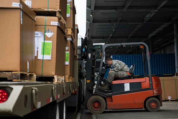 U.S. Air Force Staff Sgt. Richard Leseberg, 721st Aerial Port Squadron, noncommissioned officer in charge of in-transit munitions facility, loads a pallet of rations onto a truck on Ramstein Air Base, Germany Oct. 31, 2018. The 521st Air Mobility Operations Wing hosted a flight commander course instructing company grade officers who are slated to lead operations like logistics in flight commander roles. (U.S. Air Force photo by Senior Airman Devin M. Rumbaugh)