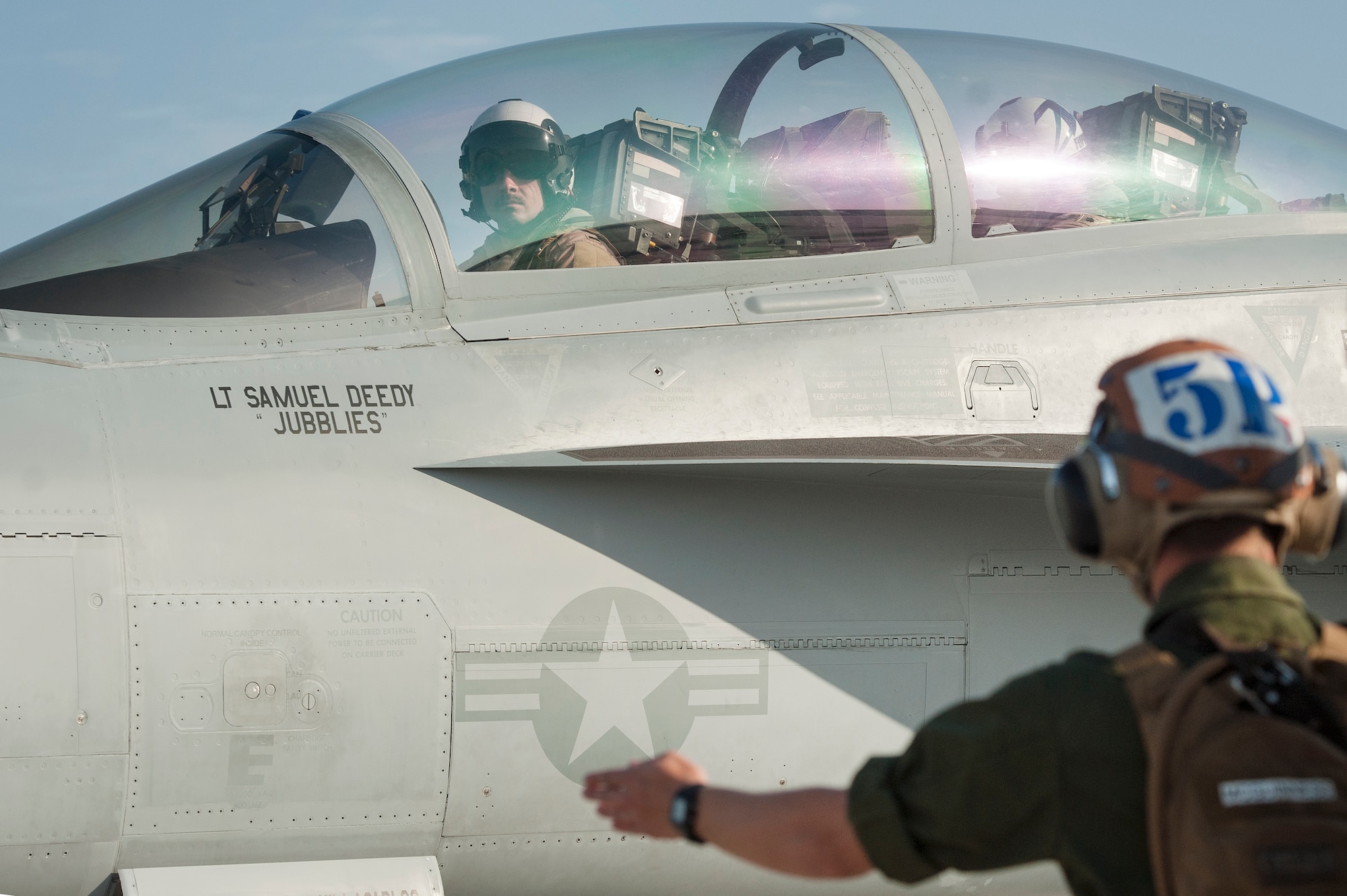 U.S. Air Force 1st Lt. Jonathan Wright, 390th Electronic Combat Squadron and Electronic Attack Squadron 135 (VAQ-135) “Black Ravens” EA-18G Growler pilot, completes his first combat flight Nov. 19, 2018, at Al Udeid Air Base, Qatar. Wright is the first Air Force pilot to operate a Growler on a combat mission. VAQ-135 is deployed to the U.S. 5th Fleet area of operations in support of naval operations to ensure maritime stability and security in the Central Region, connecting the Mediterranean and the Pacific through the western Indian Ocean and three strategic choke points. (U.S. Air Force photo by Tech. Sgt. Christopher Hubenthal)