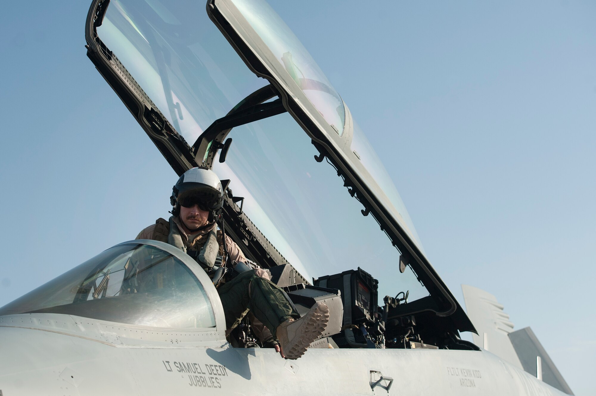 U.S. Air Force 1st Lt. Jonathan Wright, 390th Electronic Combat Squadron and Electronic Attack Squadron 135 (VAQ-135) “Black Ravens” EA-18G Growler pilot, exits the cockpit after completing his first combat flight Nov. 19, 2018, at Al Udeid Air Base, Qatar. Wright is the first Air Force pilot to operate a Growler on a combat mission. VAQ-135 is deployed to the U.S. 5th Fleet area of operations in support of naval operations to ensure maritime stability and security in the Central Region, connecting the Mediterranean and the Pacific through the western Indian Ocean and three strategic choke points. (U.S. Air Force photo by Tech. Sgt. Christopher Hubenthal)