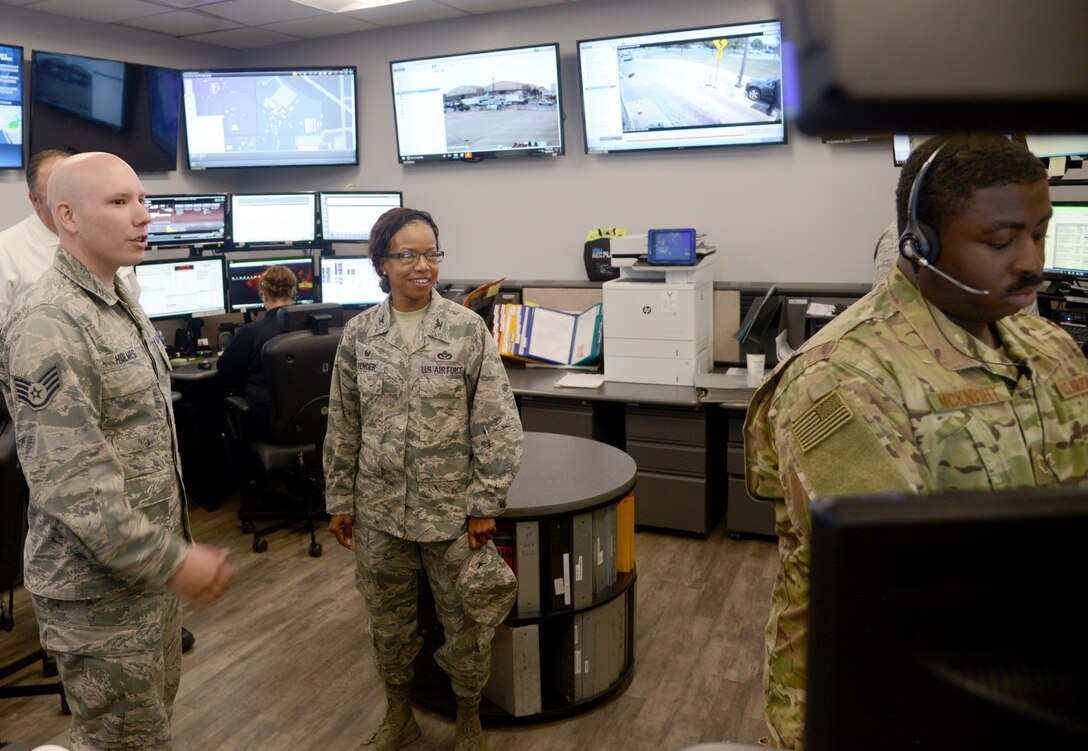 Staff Sgt. Rafe Holmes, 72nd Security Forces Squadron, guides Col. Yvonne Spencer through Tinker Air Force Base’s Emergency Communication Center during her visit Oct. 30-31. Spencer, Air Force Installation and Mission Support Center Det. 6 commander, met with 72nd Air Base Wing leadership and had breakout sessions and tours with organizations across the wing to gain insight into installation needs to better advocate for AFIMSC resources.