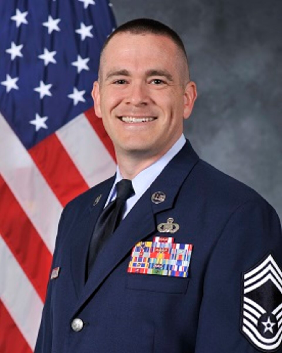 Chief Master Sergeant Daniel J. Kenemore is the Chief Enlisted Manager for the United States Air Force Band of Mid-America, Headquarters Air Mobility Command, Scott Air Force Base, Illinois. The band is composed of sixty-one personnel and five flights including operations, publicity, resources, readiness, and administrative support. Additionally, the band maintains thirteen performance teams that execute more than 400 missions each year in support of strategic Air Force messaging initiatives, Presidential support, civic outreach, international partnership building, recruiting, and troop support across a ten state region and at deployed locations around the world. Chief Kenemore is the principle advisor to the commander on good order and discipline, health and wellness, readiness, professional development, and training of the unit’s enlisted personnel.