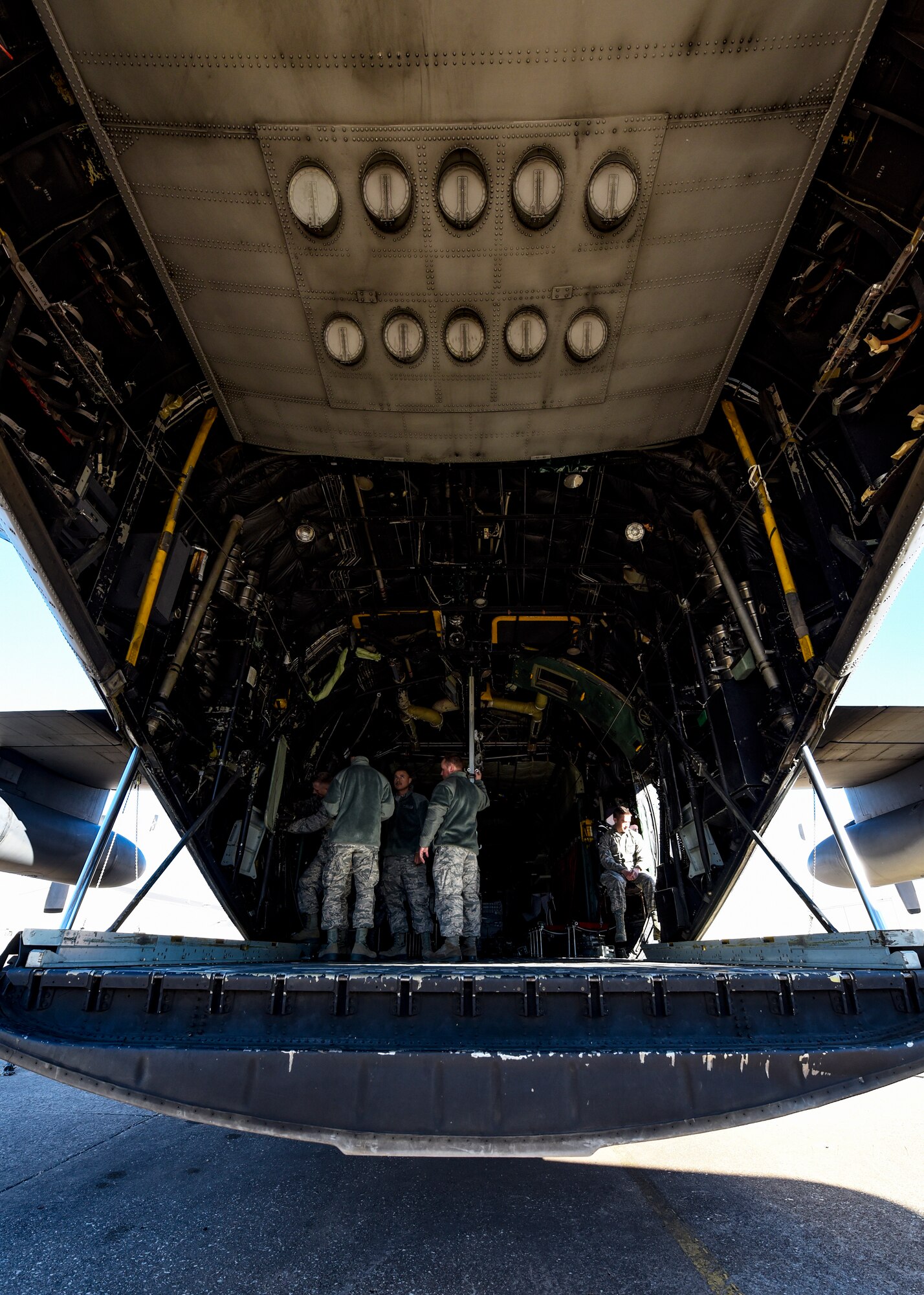 Sheppard Airmen in training work on a C-130 Hercules trainer jet.
