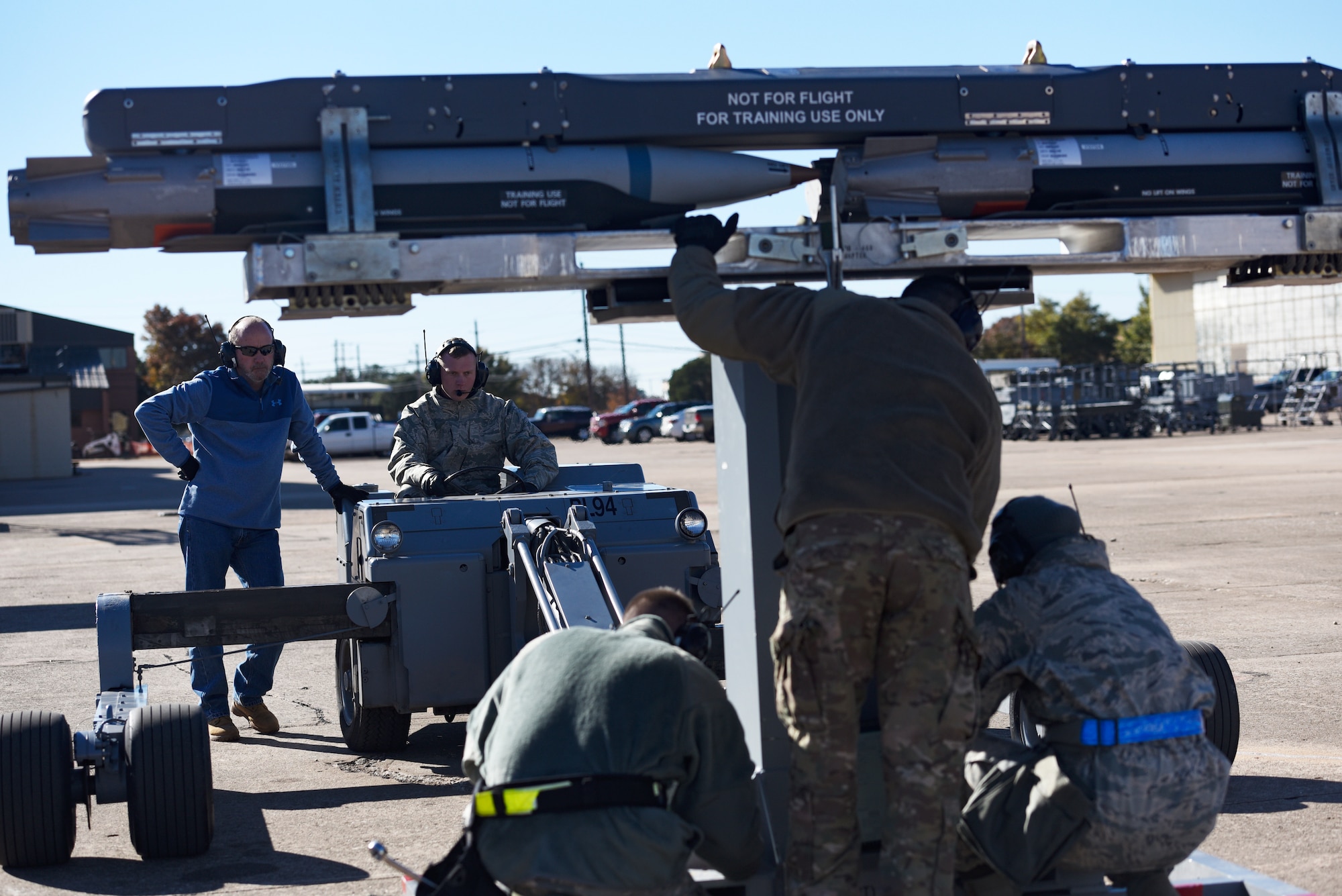 Sheppard Airmen in training work on a C-130 Hercules trainer jet.